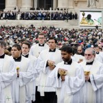 Priests heading out to perform Communion