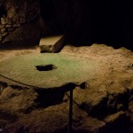 The remnants of a grain mill in a cave